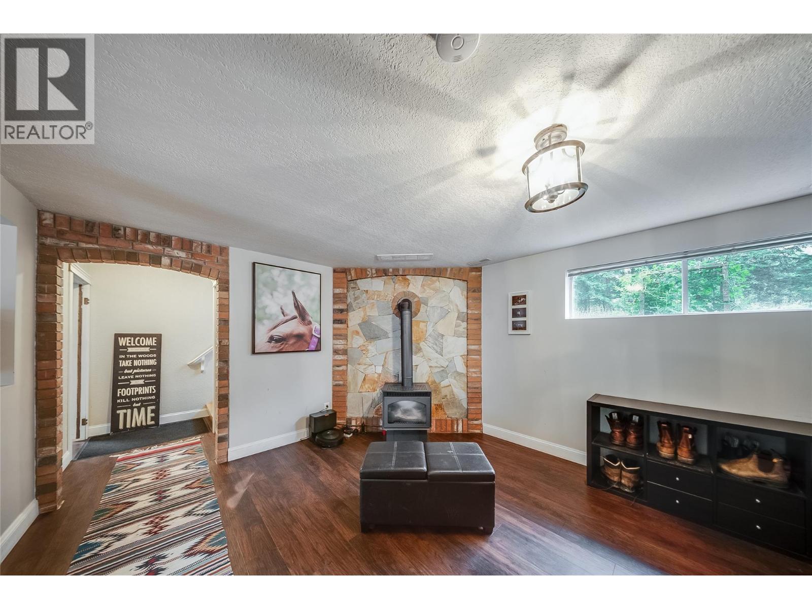 314 Webster Road, Fruitvale, BC - Indoor Photo Showing Other Room With Fireplace