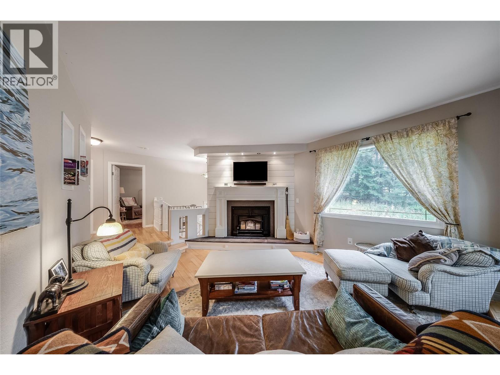 314 Webster Road, Fruitvale, BC - Indoor Photo Showing Living Room With Fireplace