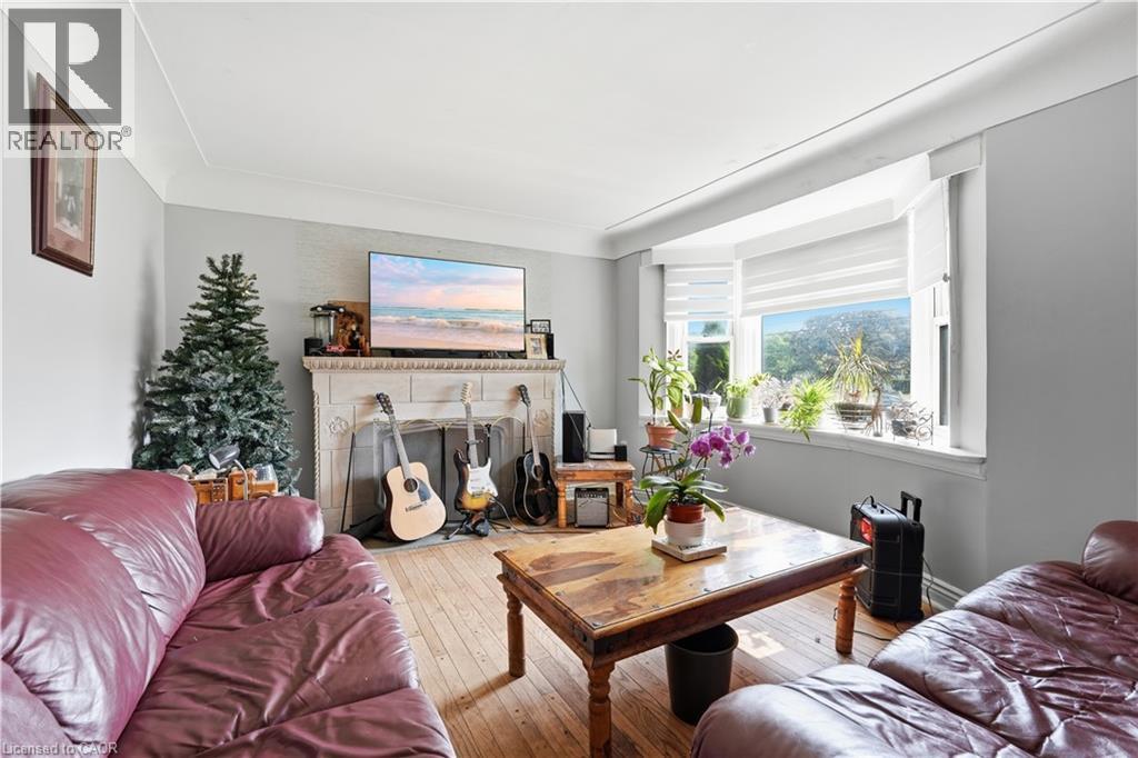 35 Centennial Parkway S, Hamilton, ON - Indoor Photo Showing Living Room With Fireplace