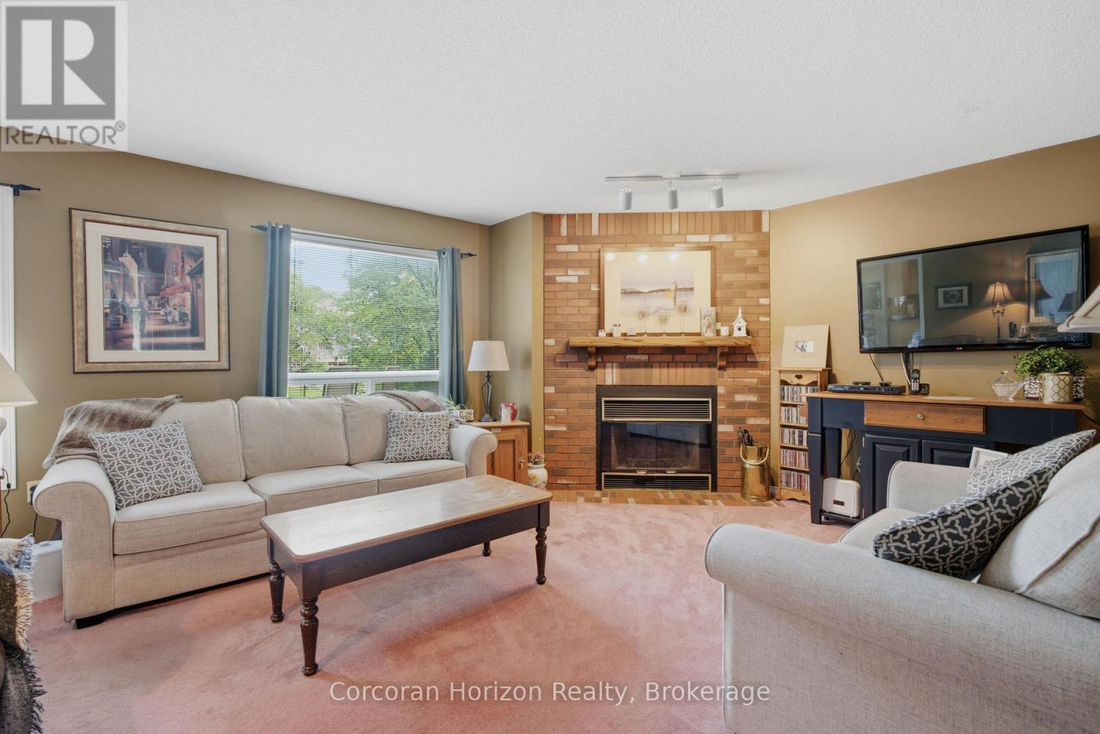 131 Huntingwood Avenue, Hamilton (Dundas), ON - Indoor Photo Showing Living Room With Fireplace
