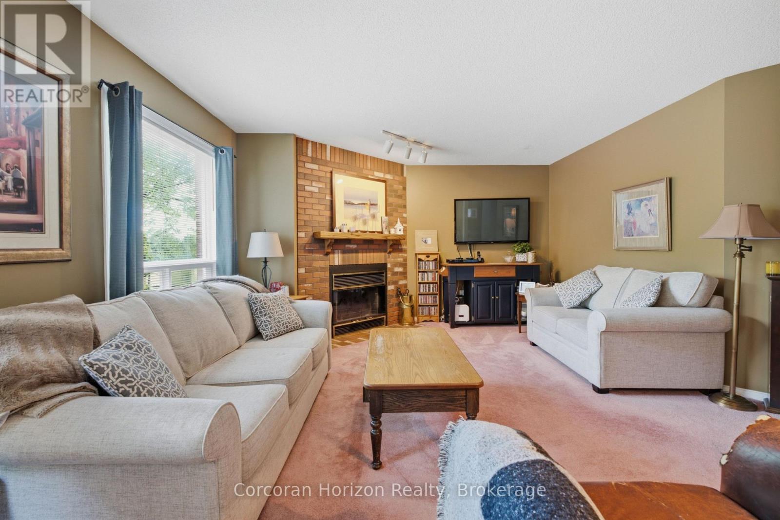 131 Huntingwood Avenue, Hamilton (Dundas), ON - Indoor Photo Showing Living Room With Fireplace