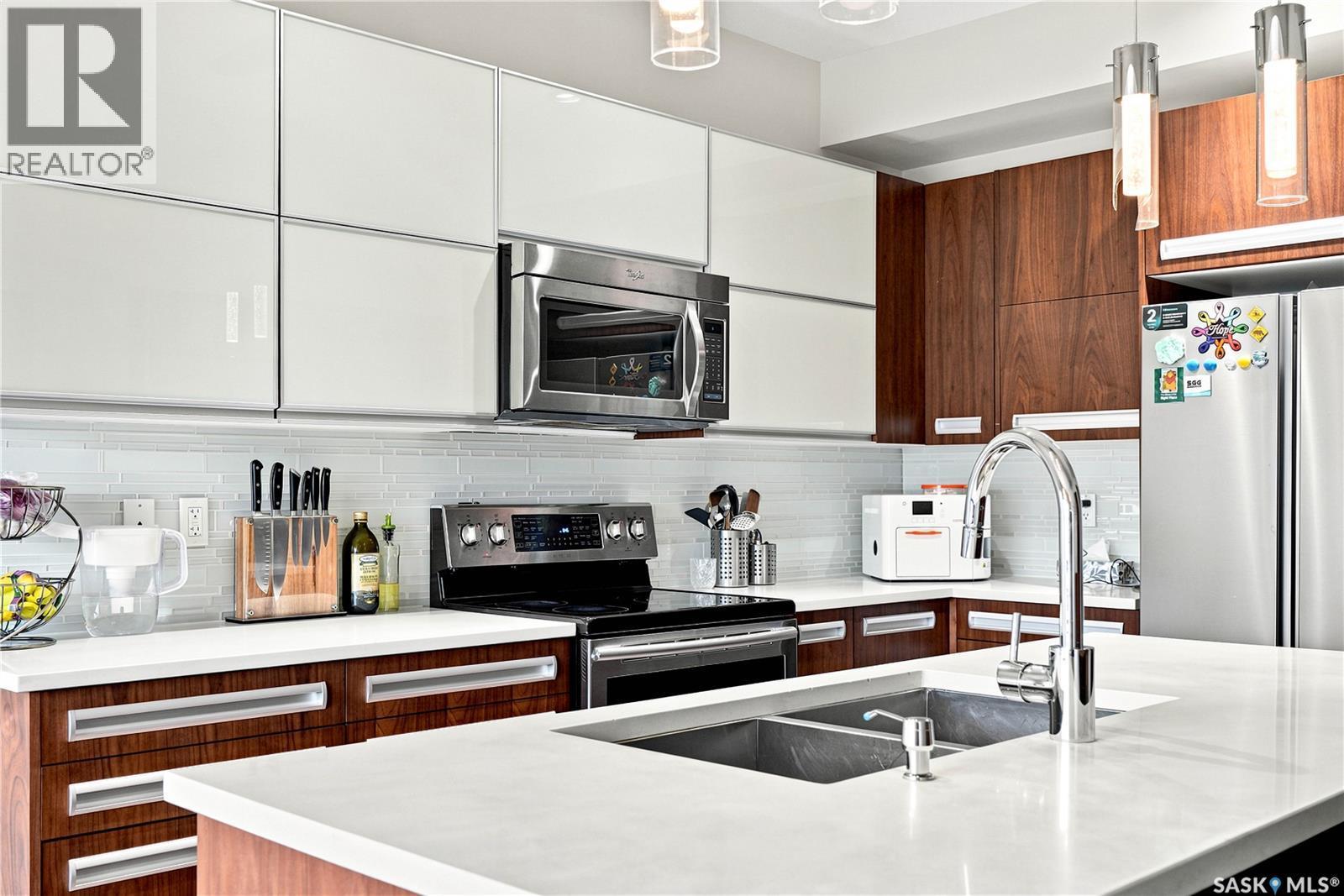 151 Tweed Lane, Saskatoon, SK - Indoor Photo Showing Kitchen With Stainless Steel Kitchen With Double Sink With Upgraded Kitchen