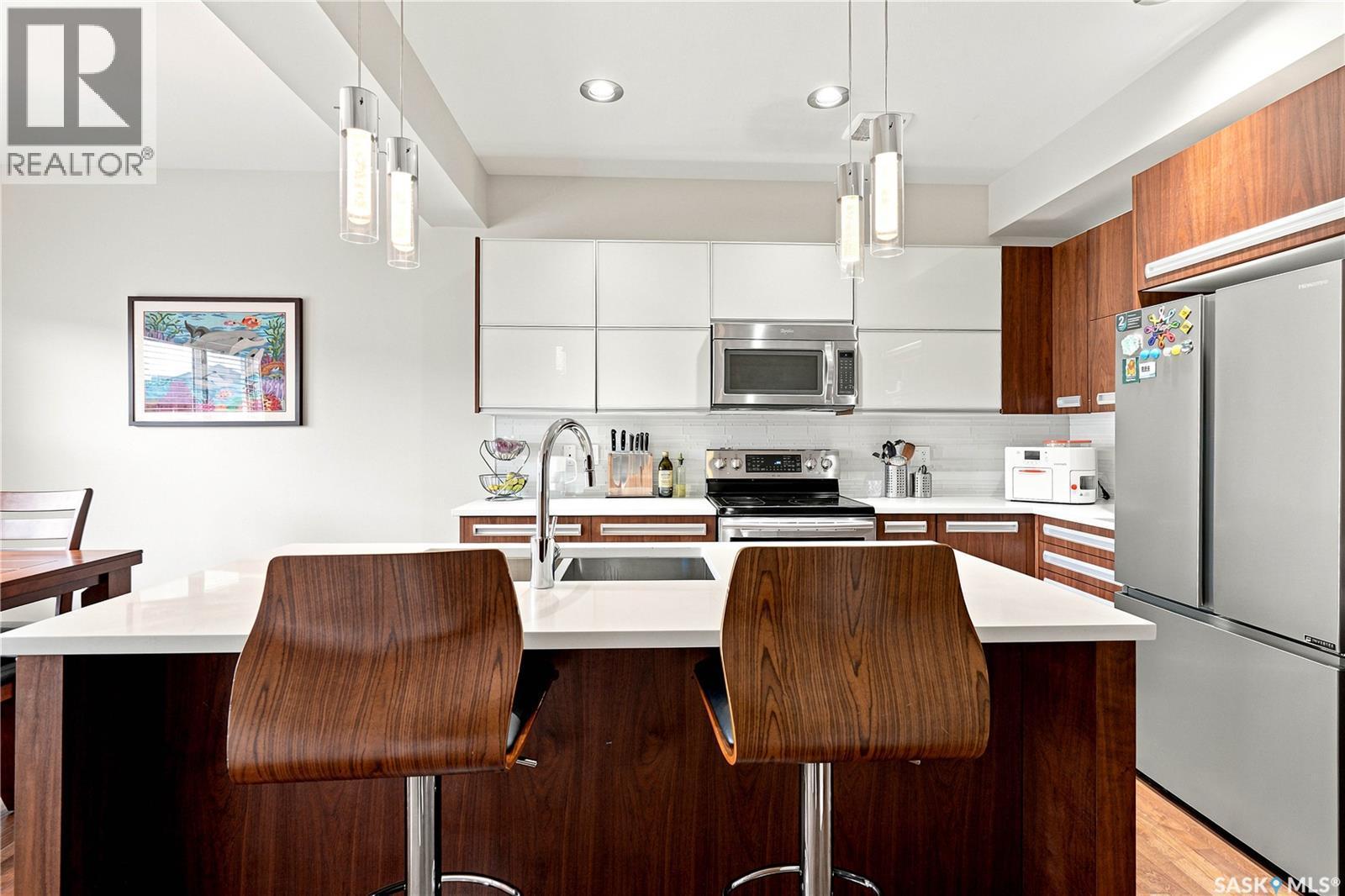 151 Tweed Lane, Saskatoon, SK - Indoor Photo Showing Kitchen With Stainless Steel Kitchen With Double Sink