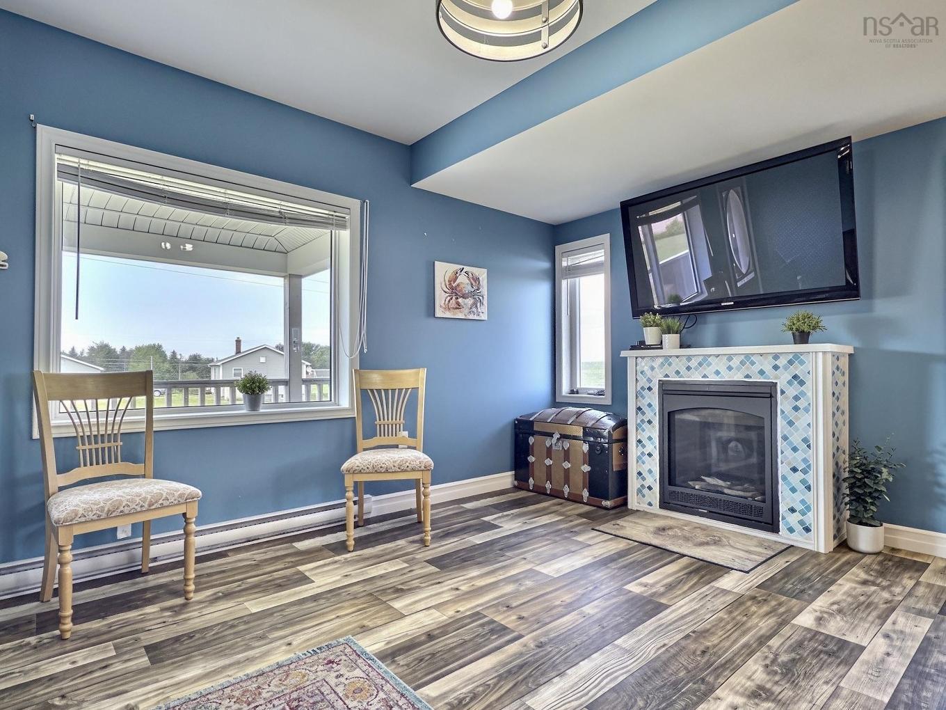 35 Chemin Broussard, Petit Étang, NS - Indoor Photo Showing Other Room With Fireplace