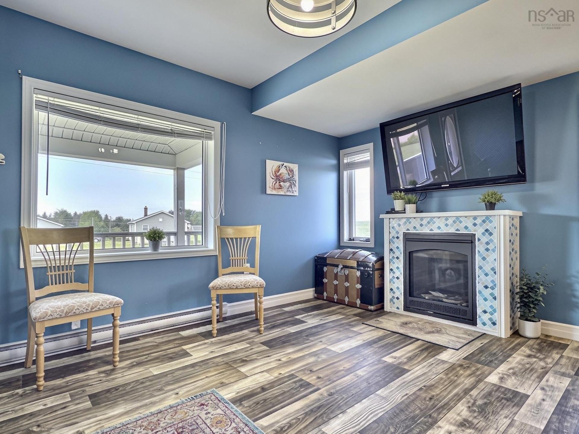 35 Chemin Broussard, Petit Étang, NS - Indoor Photo Showing Other Room With Fireplace