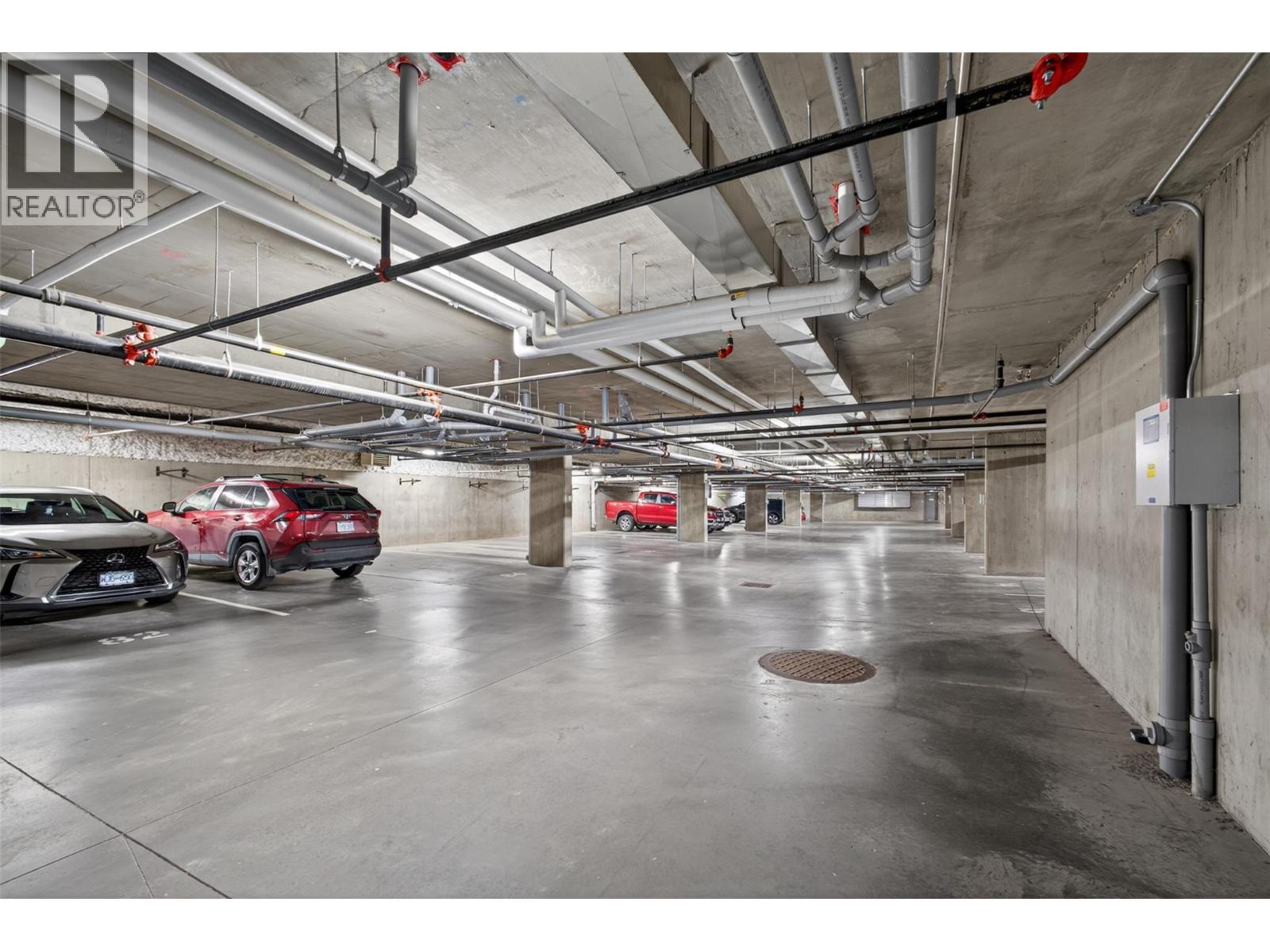Secured Parking - 881 Academy Way Unit# 312, Kelowna, BC - Indoor Photo Showing Garage