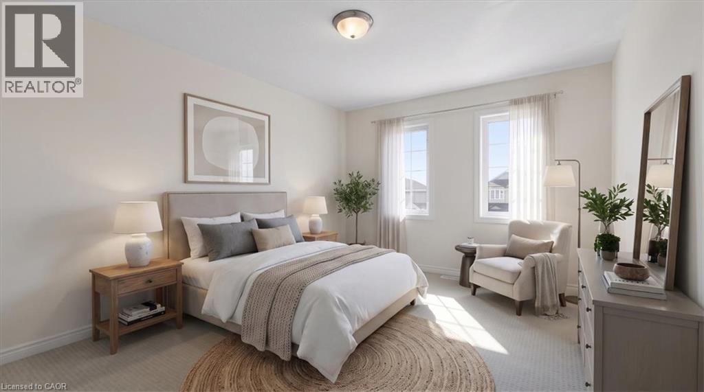 Carpeted flooring, two windows, and a flush mount ceiling light fixture - 242 Moorlands Crescent, Kitchener, ON - Indoor Photo Showing Bedroom