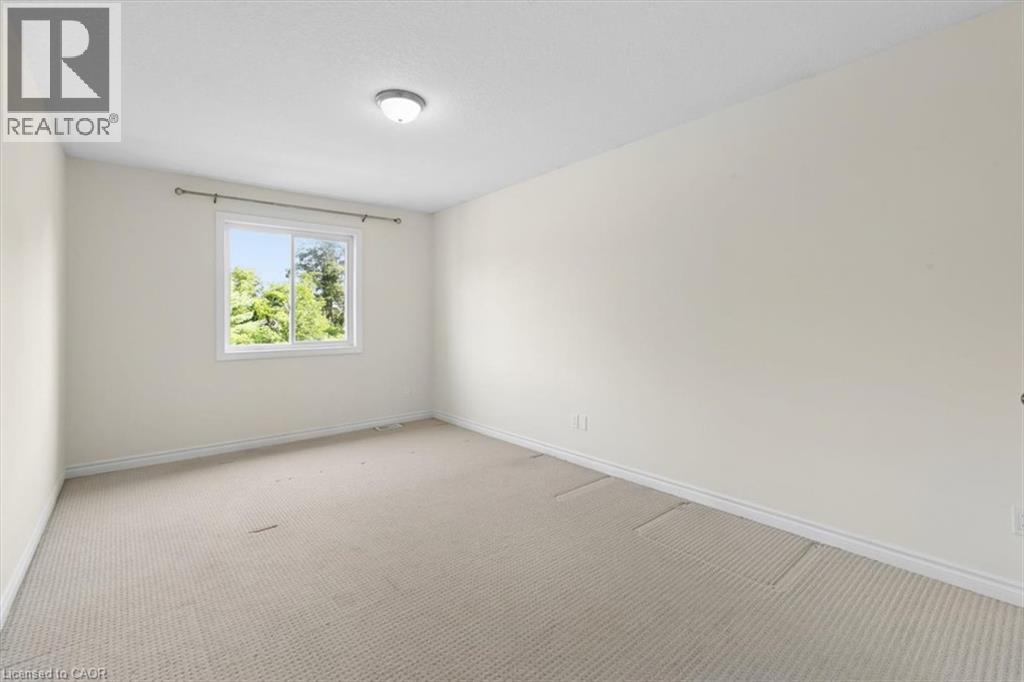 Recessed ceiling light fixture and a single window with white trim - 242 Moorlands Crescent, Kitchener, ON - Indoor Photo Showing Other Room