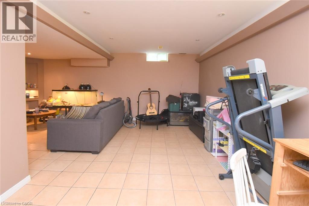 Spacious basement area can be used for gym equipment or kids play area. - 509 Southridge Drive, Hamilton, ON - Indoor