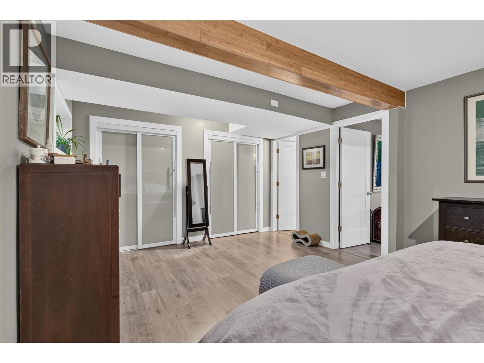 His and her closets. - 3703 Commonage Crescent, Vernon, BC - Indoor Photo Showing Bedroom