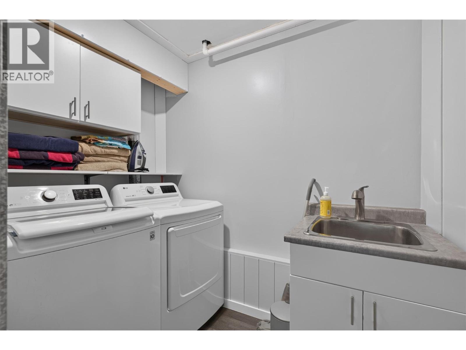Convenient lower-level laundry area - 3703 Commonage Crescent, Vernon, BC - Indoor Photo Showing Laundry Room