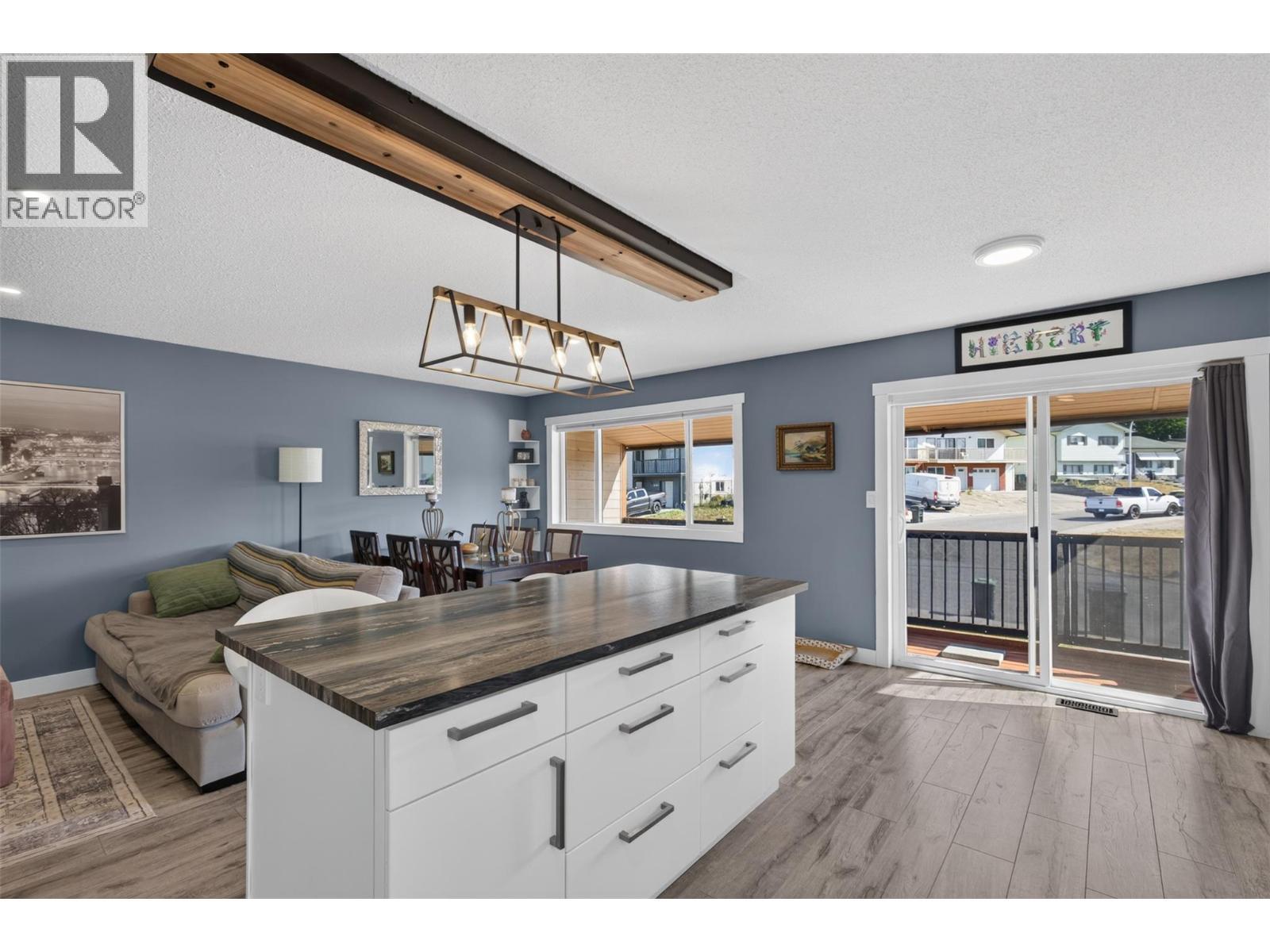 Generous kitchen island offers extra prep space and seating. - 3703 Commonage Crescent, Vernon, BC - Indoor