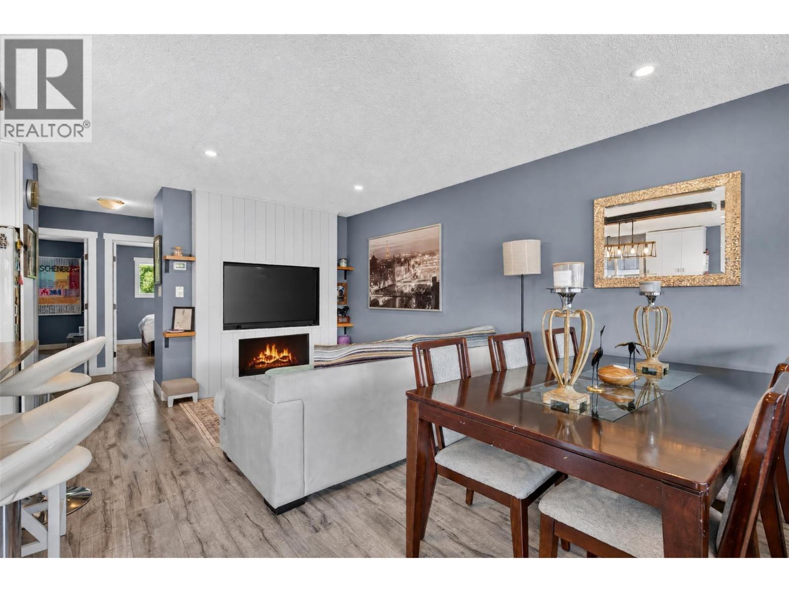 Bright dining area conveniently located beside the kitchen and living room. - 3703 Commonage Crescent, Vernon, BC - Indoor With Fireplace