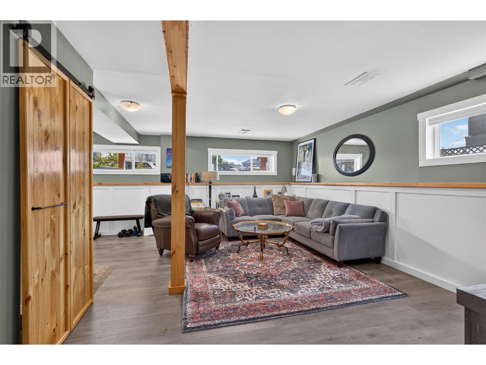 Comfortable lower-level family room, perfect for relaxing or movie nights. - 3703 Commonage Crescent, Vernon, BC - Indoor