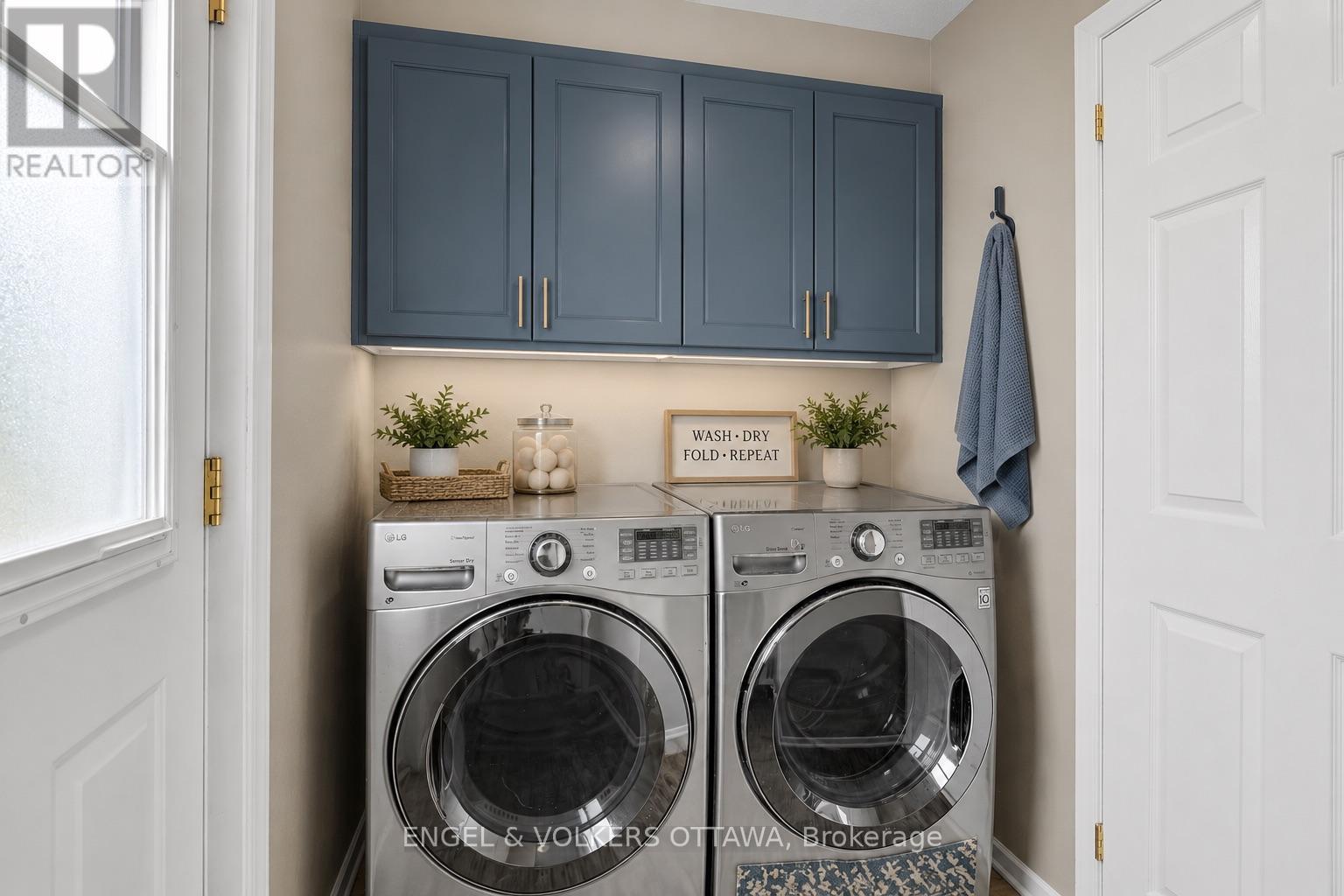 Main Floor Laundry Room - Virtually Staged - 28 Weybridge Drive, Ottawa, ON - Indoor Photo Showing Laundry Room