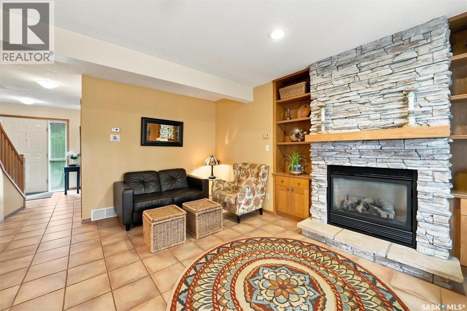 Crescent 211 David Knight Crescent, Saskatoon, SK - Indoor Photo Showing Living Room With Fireplace