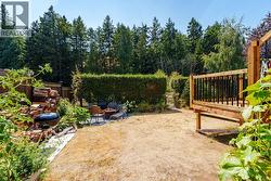 Tall hedge and gate access to serene Trillium Park -