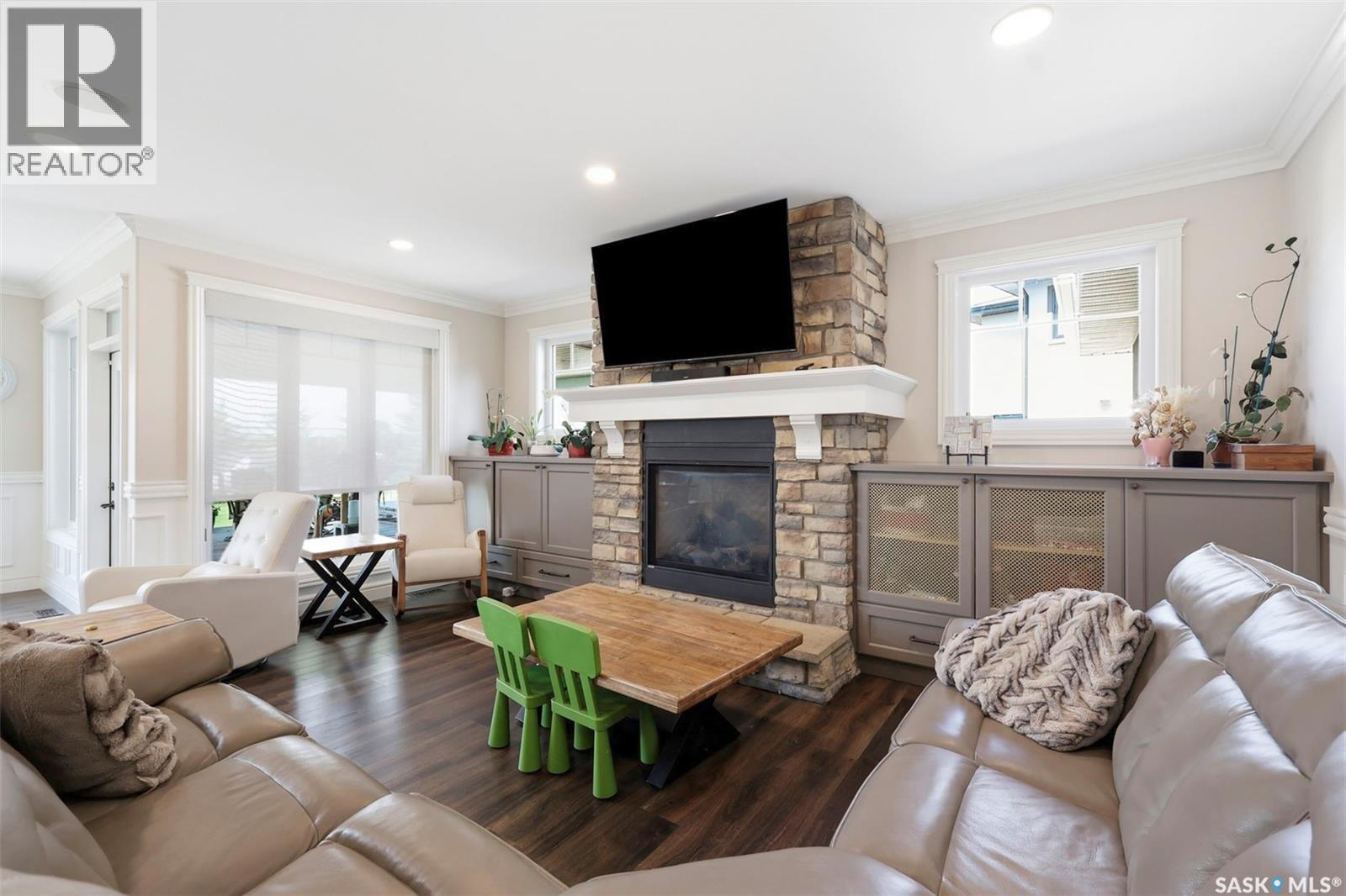 419 Salloum Bay, Saskatoon, SK - Indoor Photo Showing Living Room With Fireplace