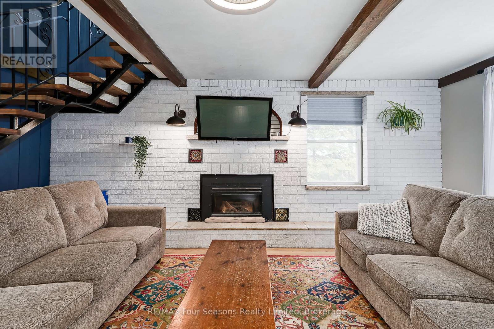 5803 26 Highway, Clearview, ON - Indoor Photo Showing Living Room With Fireplace