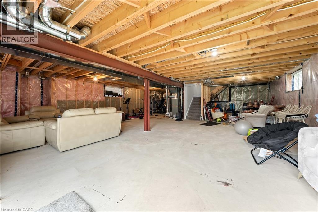 Spacious unfinished basement offering extensive potential for customization - 130 Pondcliffe Drive, Kitchener, ON - Indoor Photo Showing Basement