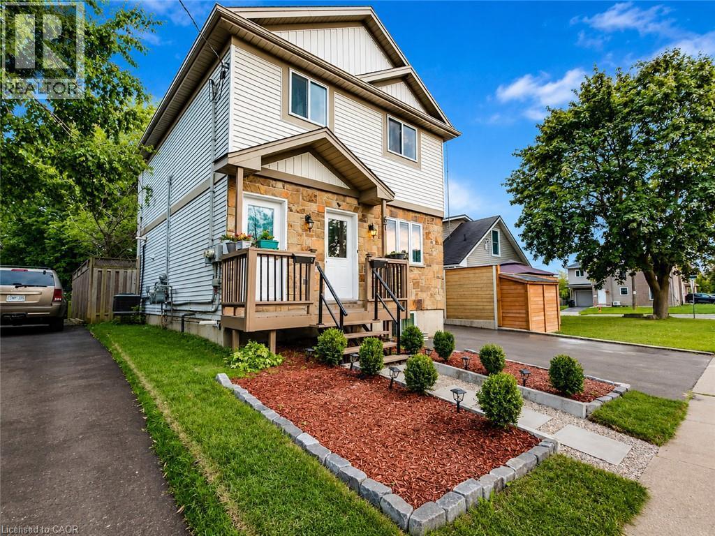 Stone and siding exterior with a front porch - 67 Kinzie Avenue, Kitchener, ON - Outdoor