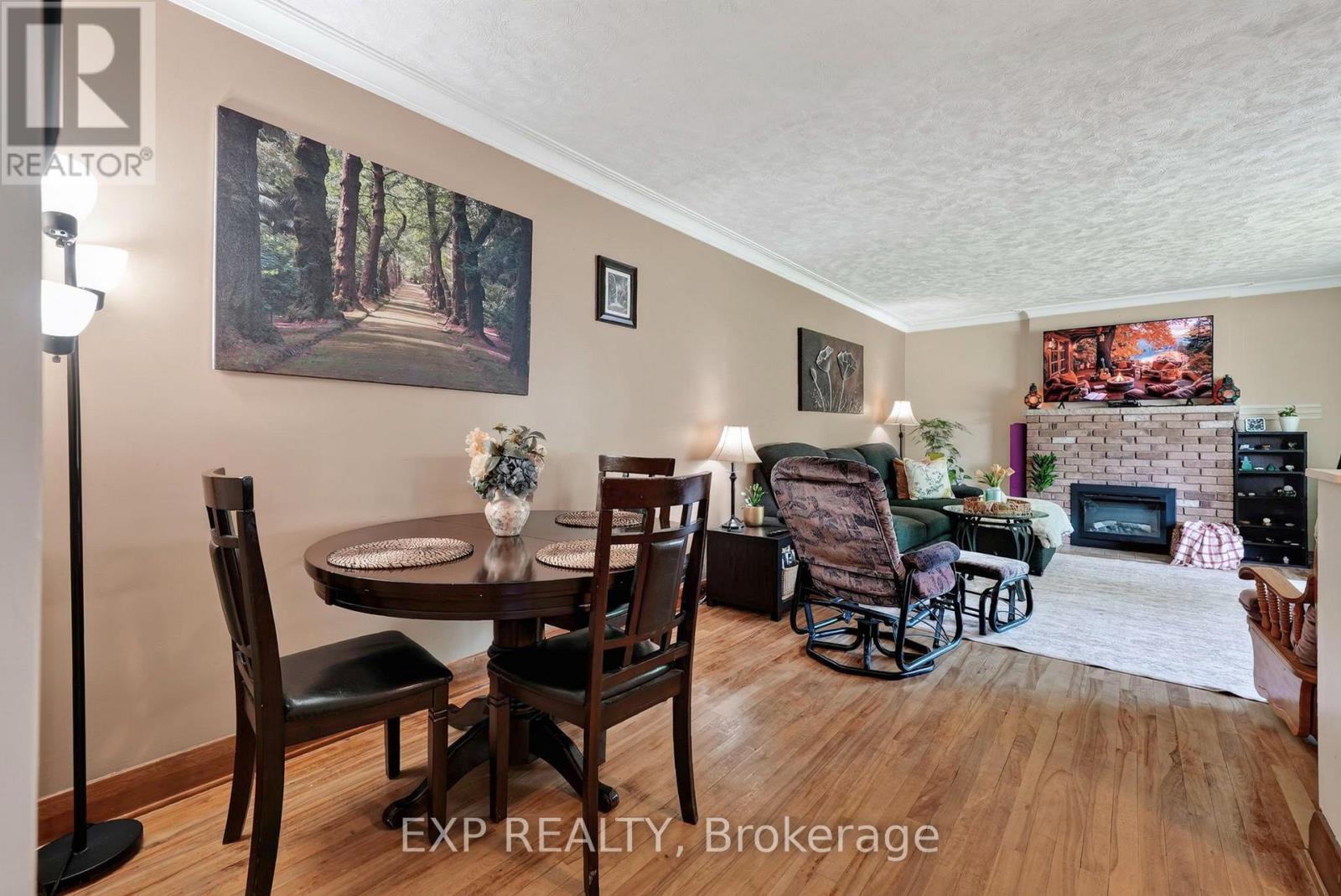 1304 Leonard Avenue, Cornwall, ON - Indoor Photo Showing Dining Room With Fireplace