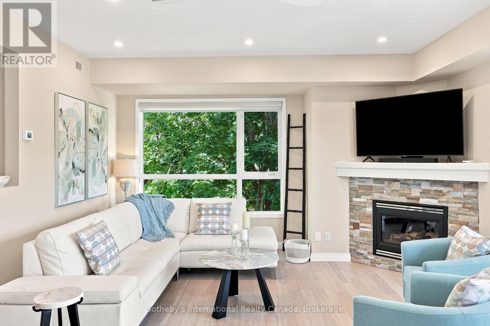 464 Mariners Way, Collingwood, ON - Indoor Photo Showing Living Room With Fireplace