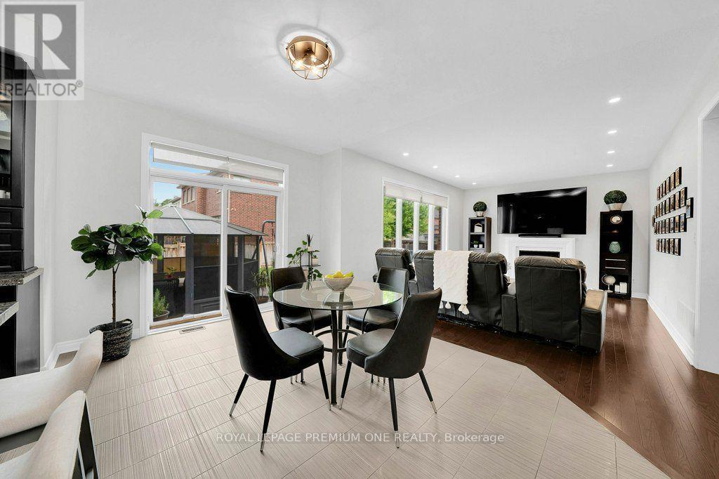 14 Atchison Drive, Caledon, ON - Indoor Photo Showing Dining Room With Fireplace