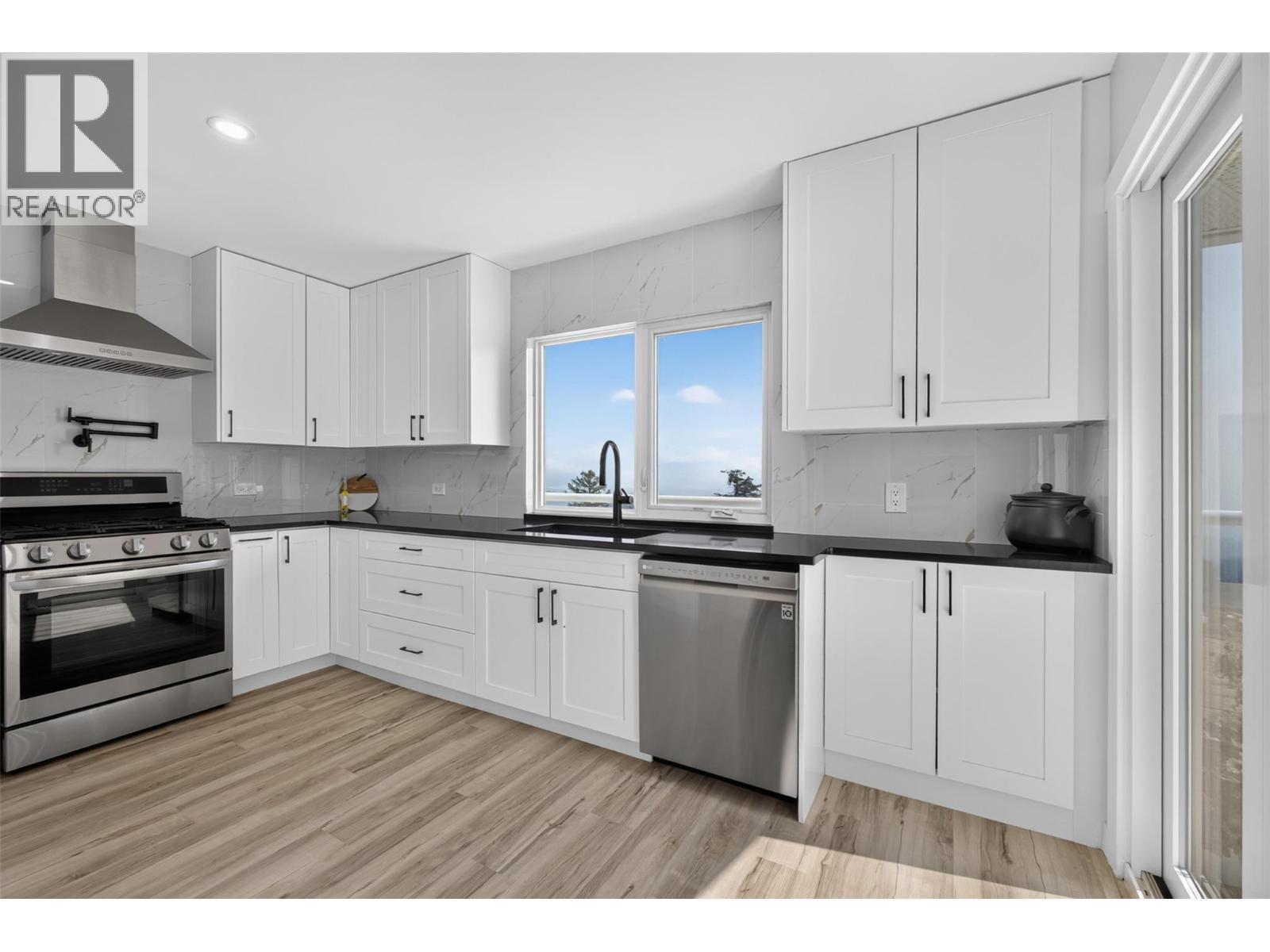 With incredible views from the sink - 3491 Fenton Road, West Kelowna, BC - Indoor Photo Showing Kitchen
