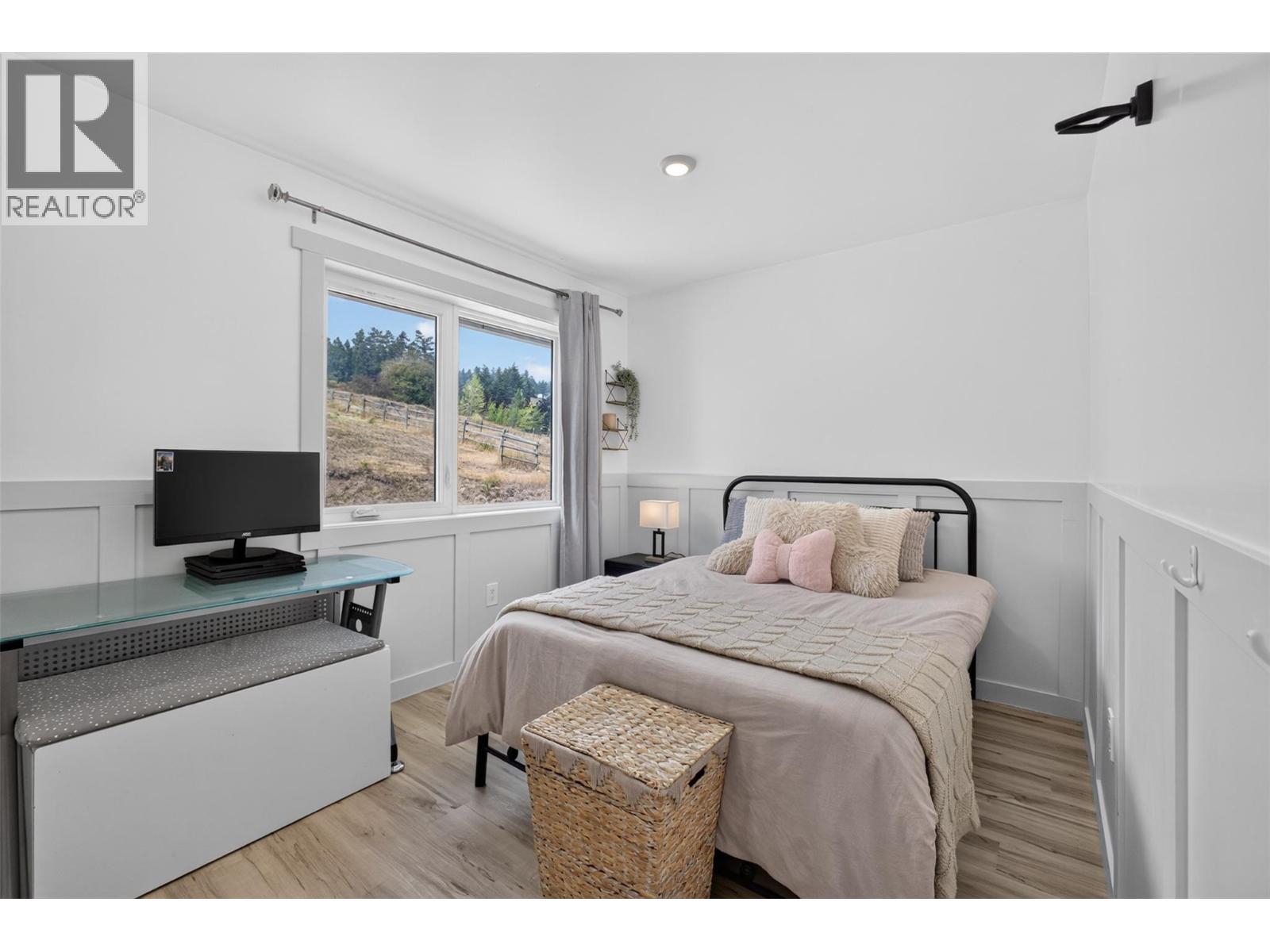 Secondary bedroom on the main level - 3491 Fenton Road, West Kelowna, BC - Indoor Photo Showing Bedroom