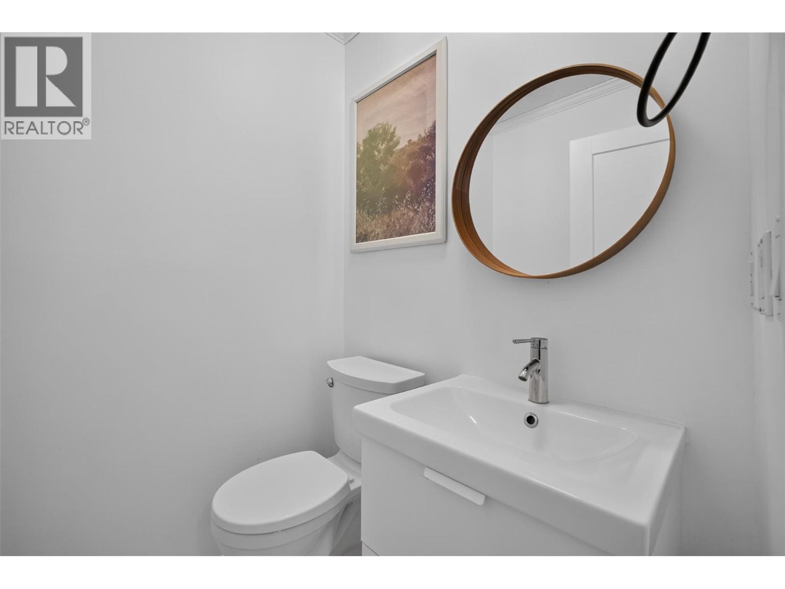 Powder room on the main level - 3491 Fenton Road, West Kelowna, BC - Indoor Photo Showing Bedroom