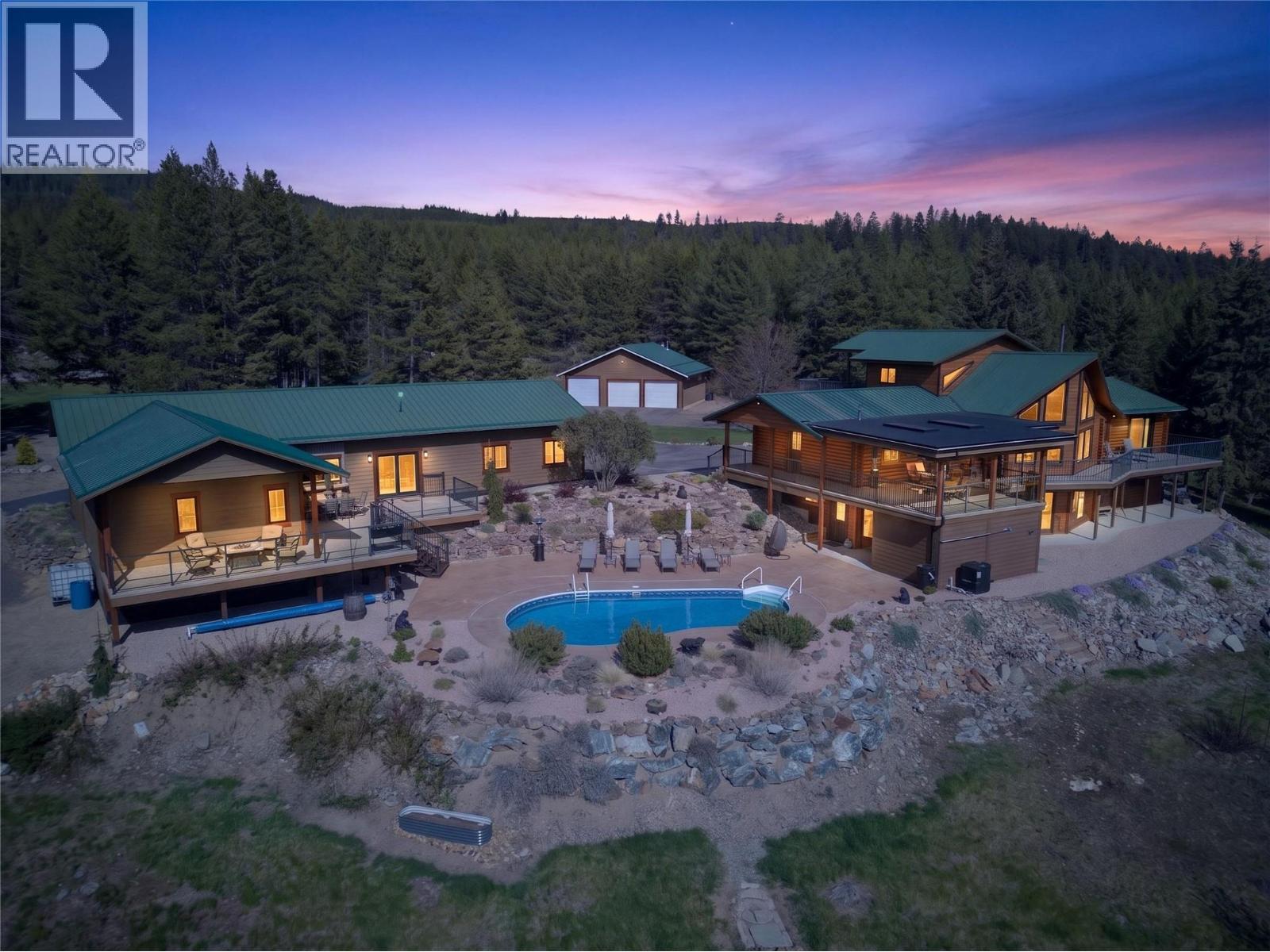 Featuring a home, a detached shop, an outbuilding & lots of land for usage - 7319 Trapper Court, Kelowna, BC - Outdoor With In Ground Pool With Deck Patio Veranda
