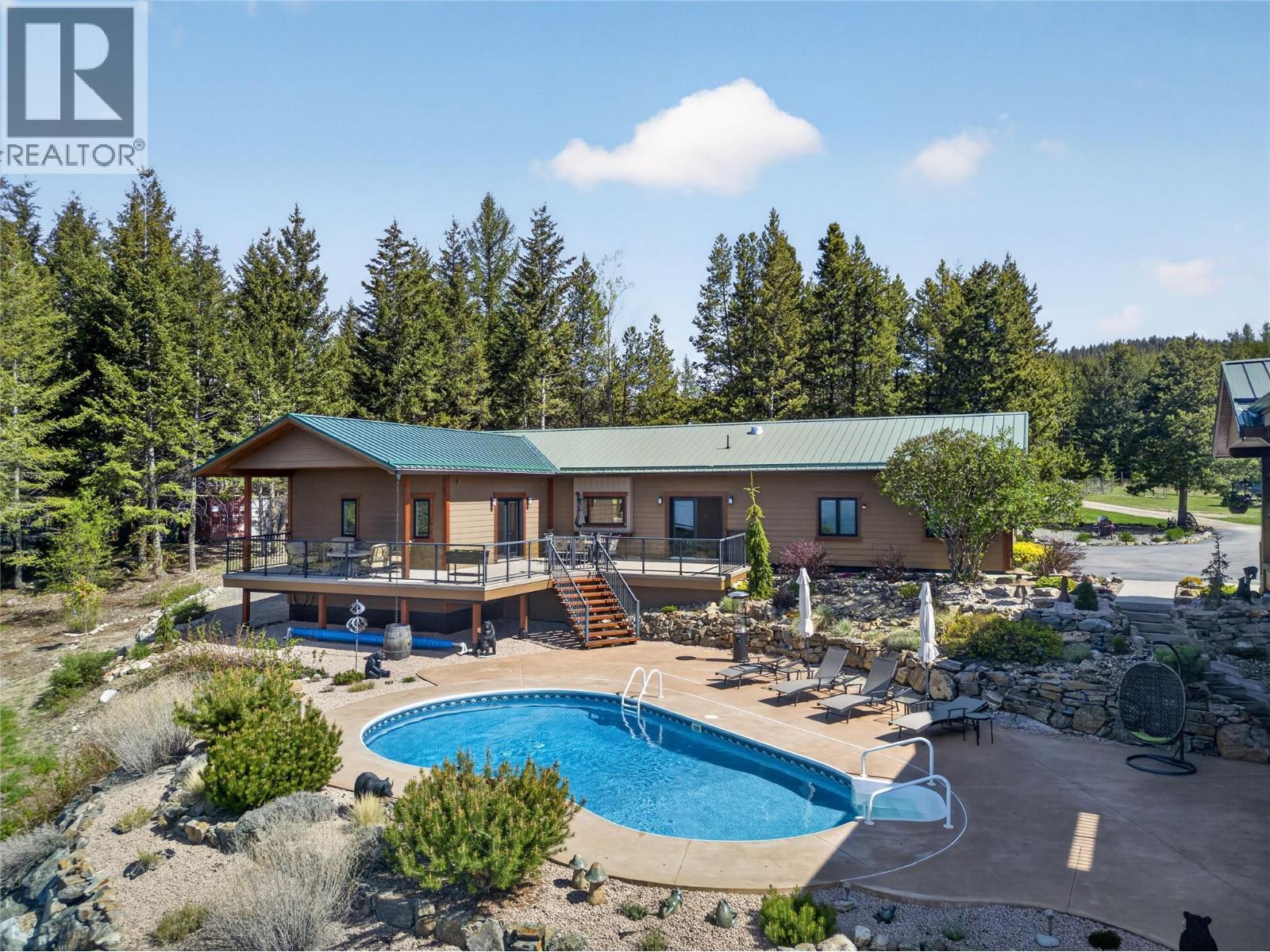 7319 Trapper Court, Kelowna, BC - Outdoor With In Ground Pool With Deck Patio Veranda