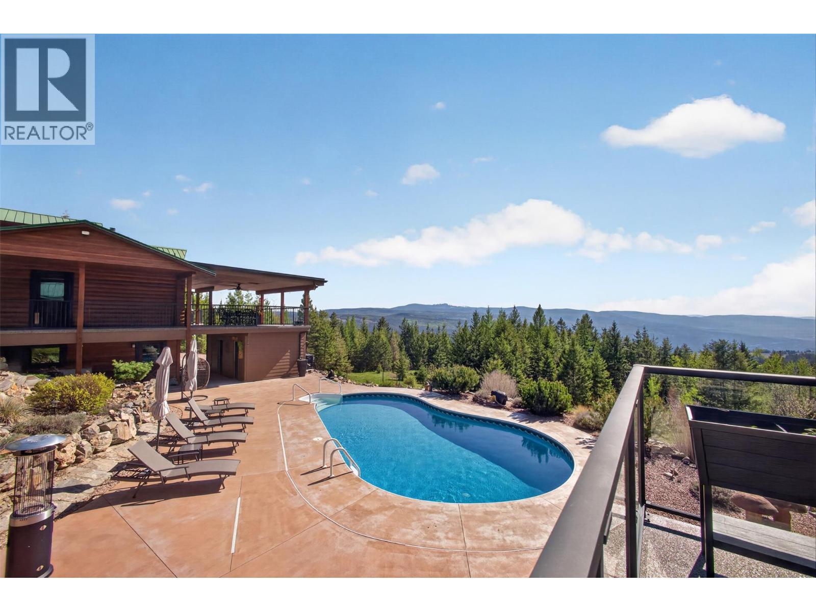 7319 Trapper Court, Kelowna, BC - Outdoor With In Ground Pool With Deck Patio Veranda