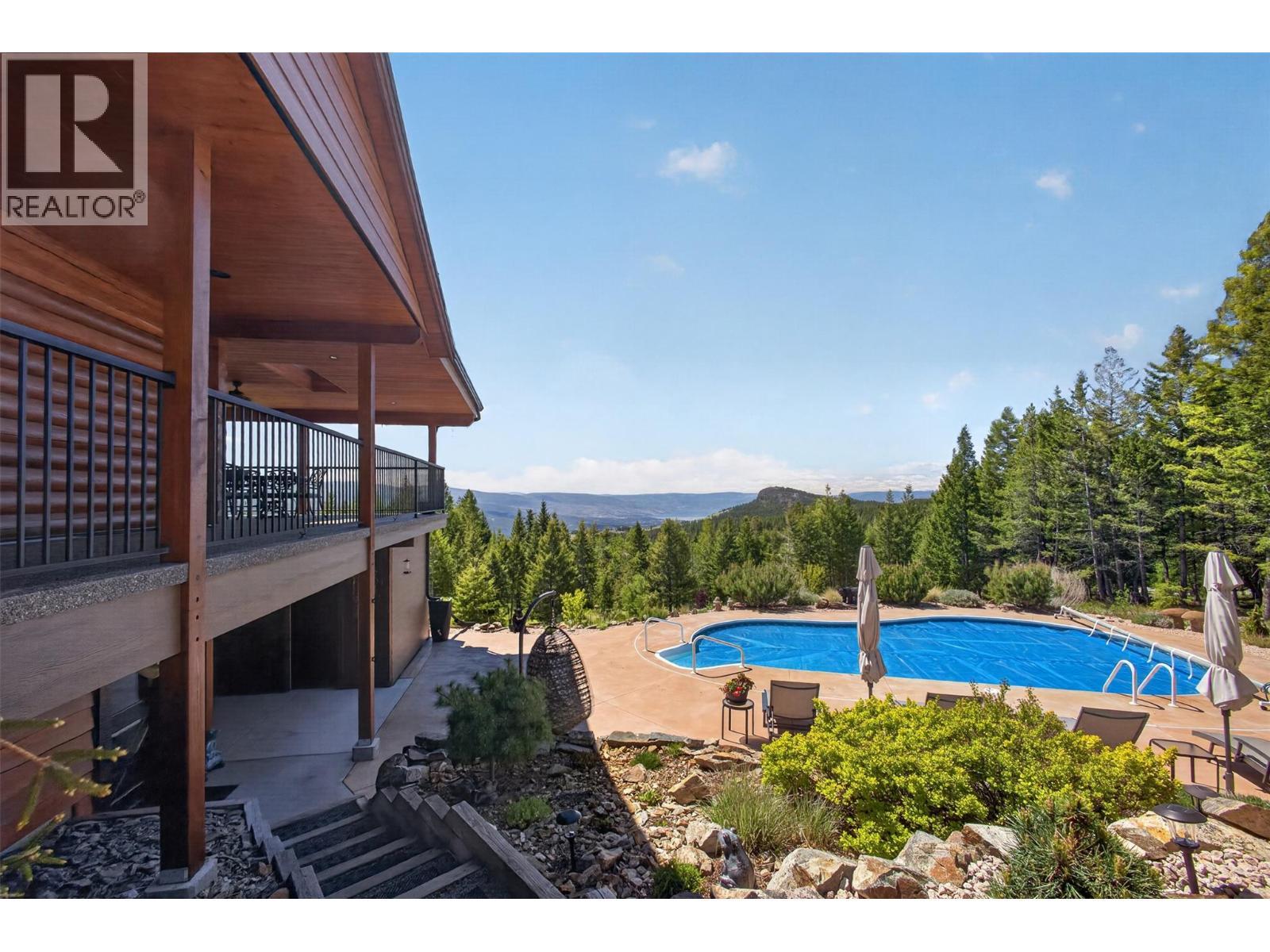 7319 Trapper Court, Kelowna, BC - Outdoor With In Ground Pool