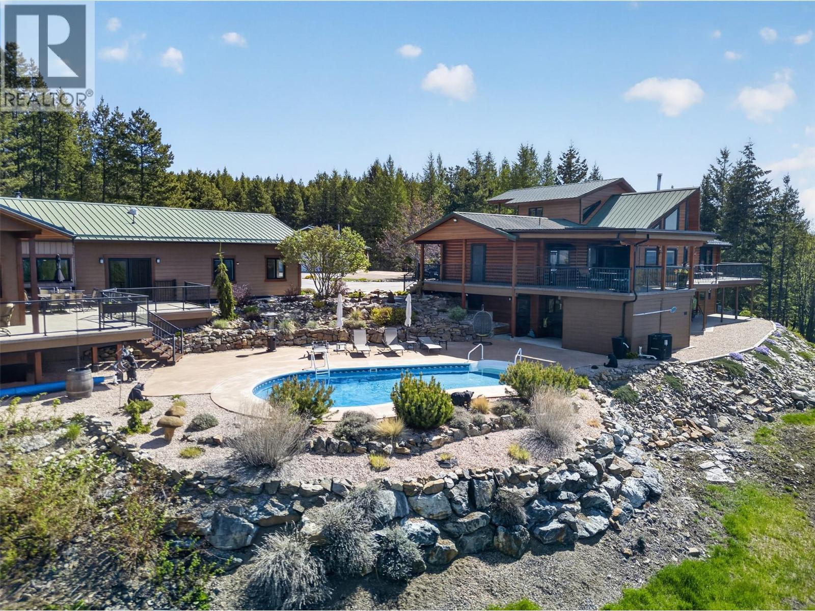Set up to be your own private retreat - 7319 Trapper Court, Kelowna, BC - Outdoor With In Ground Pool With Deck Patio Veranda