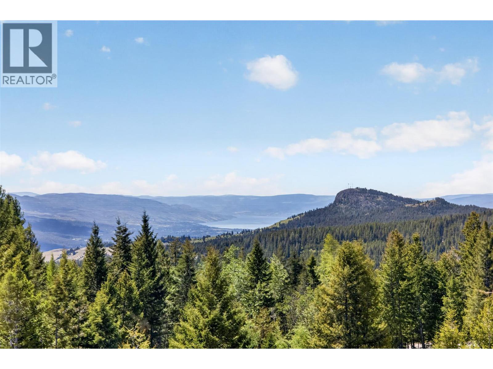 With stunning lake, mountain & forestry sights - 7319 Trapper Court, Kelowna, BC - Outdoor With View