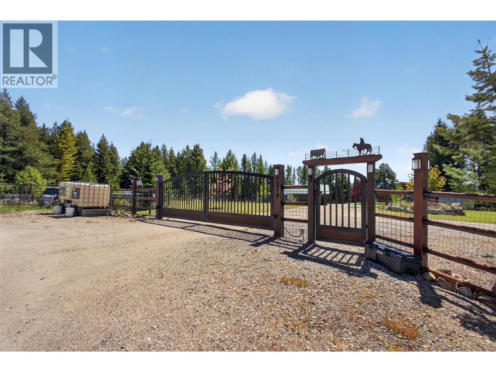 Automatic gate with man door - 7319 Trapper Court, Kelowna, BC - Outdoor