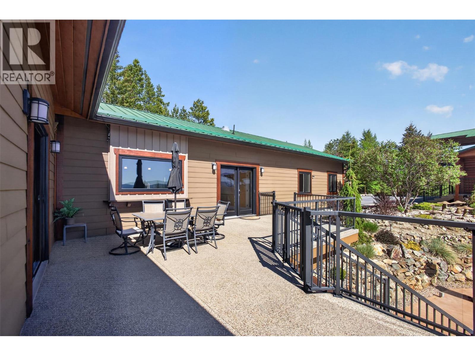 Legal outbuilding with non-conforming kitchen - 7319 Trapper Court, Kelowna, BC - Outdoor With Deck Patio Veranda With Exterior