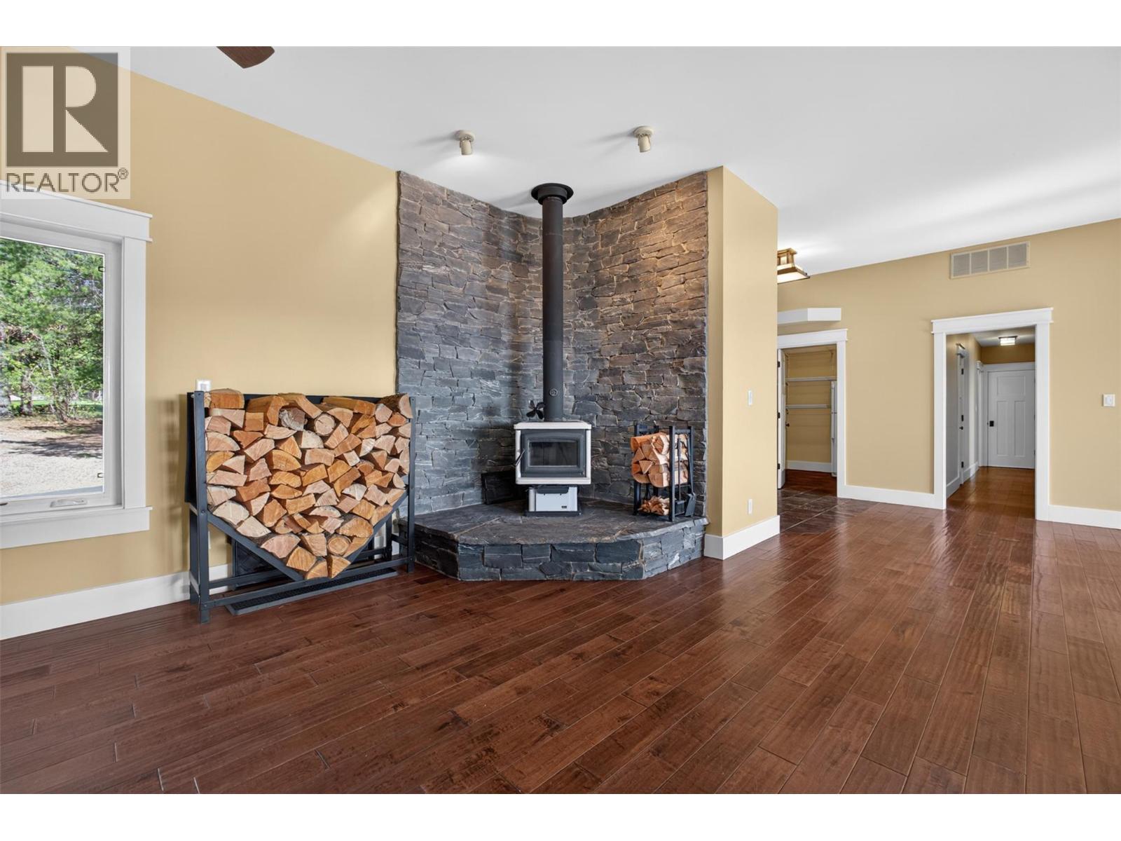 Legal outbuilding with non-conforming kitchen - 7319 Trapper Court, Kelowna, BC - Indoor With Fireplace
