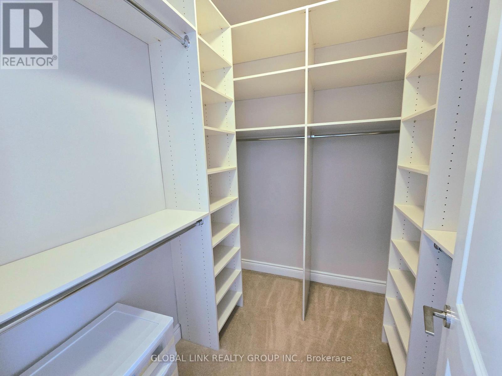 Primary BR walk-in closet - Uph 01 - 88 Times Avenue, Markham, ON - Indoor With Storage
