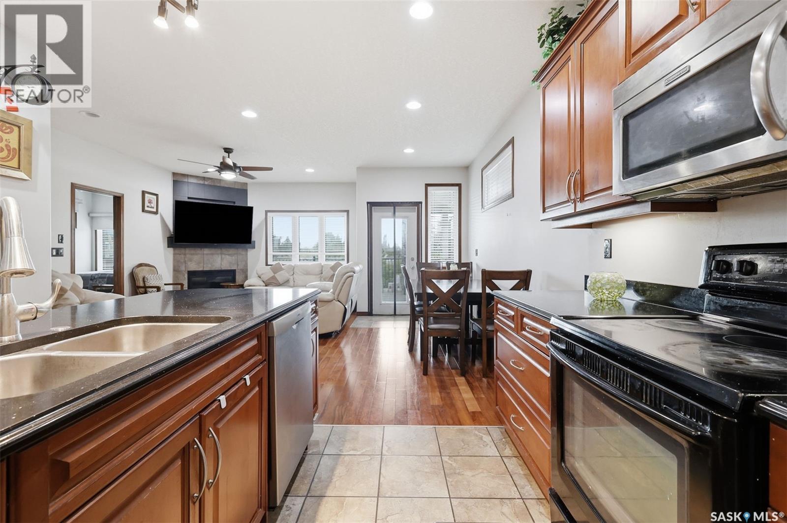 206 Muzyka Road, Saskatoon, SK - Indoor Photo Showing Kitchen With Double Sink