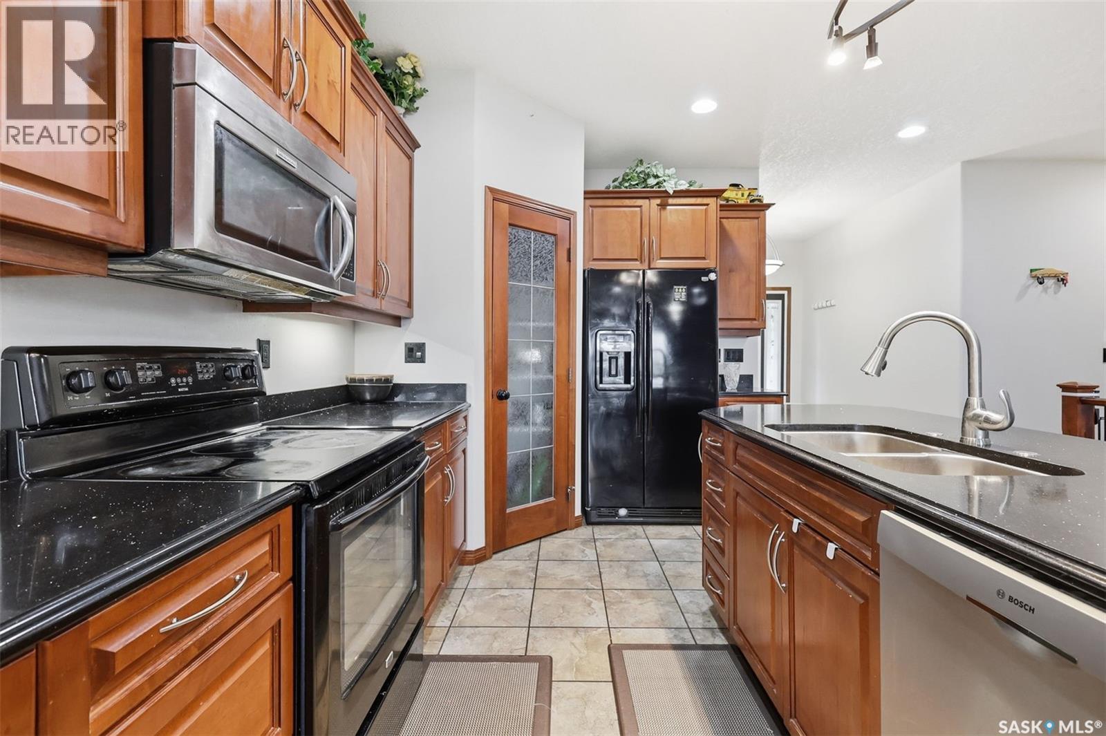 206 Muzyka Road, Saskatoon, SK - Indoor Photo Showing Kitchen With Double Sink