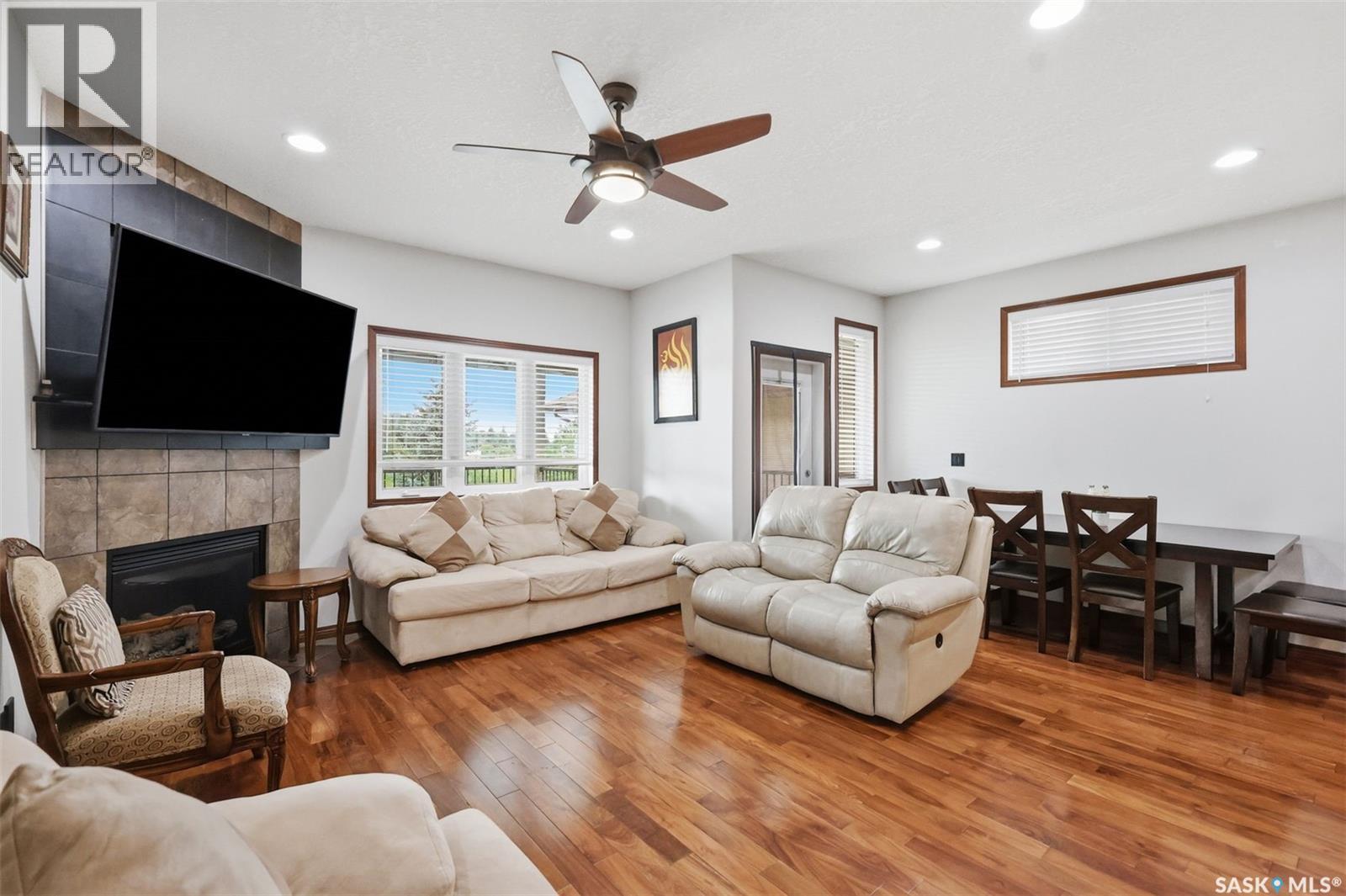 206 Muzyka Road, Saskatoon, SK - Indoor Photo Showing Living Room With Fireplace