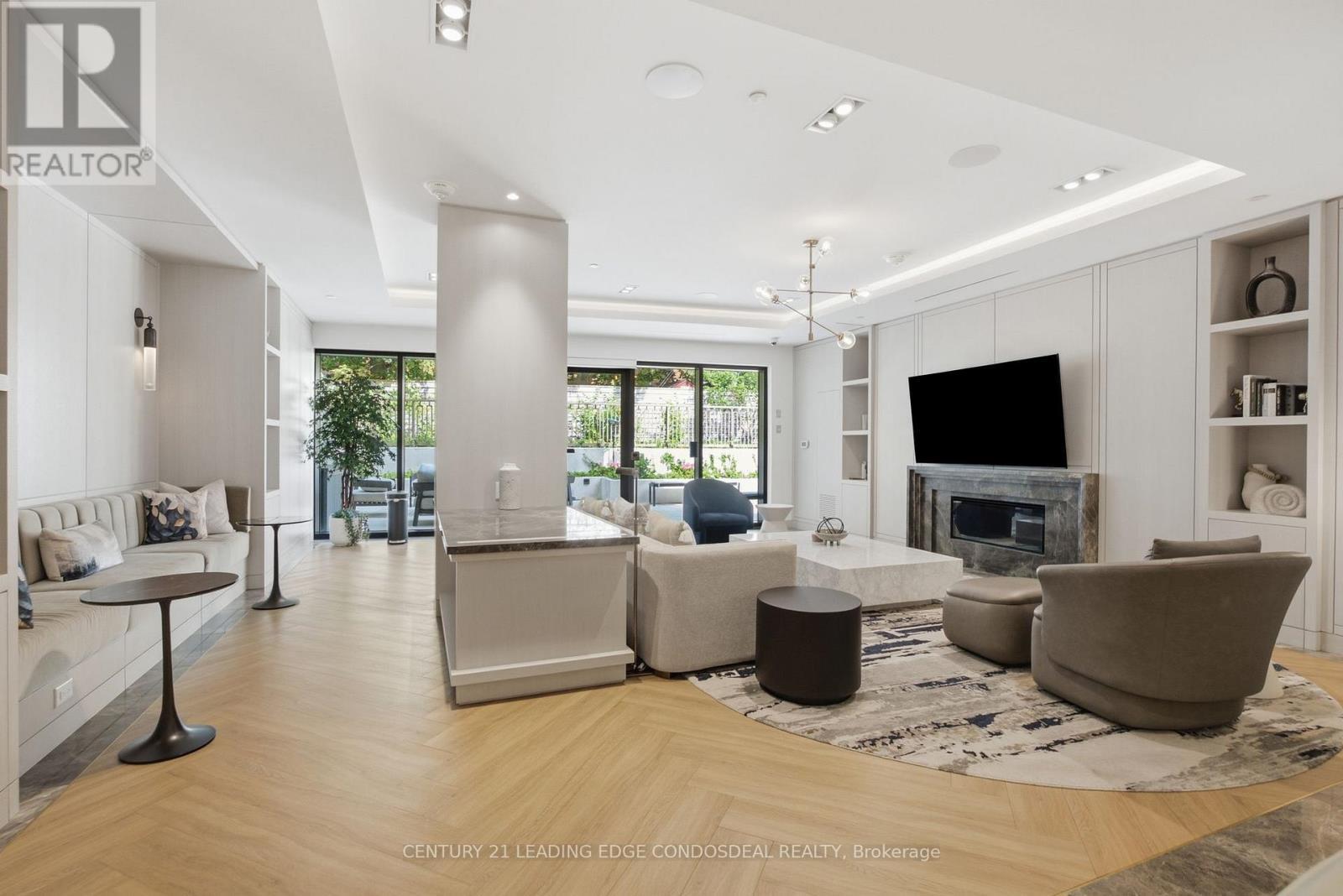 Building Party Room - 503 - 1 Strathgowan Avenue, Toronto, ON - Indoor Photo Showing Living Room With Fireplace