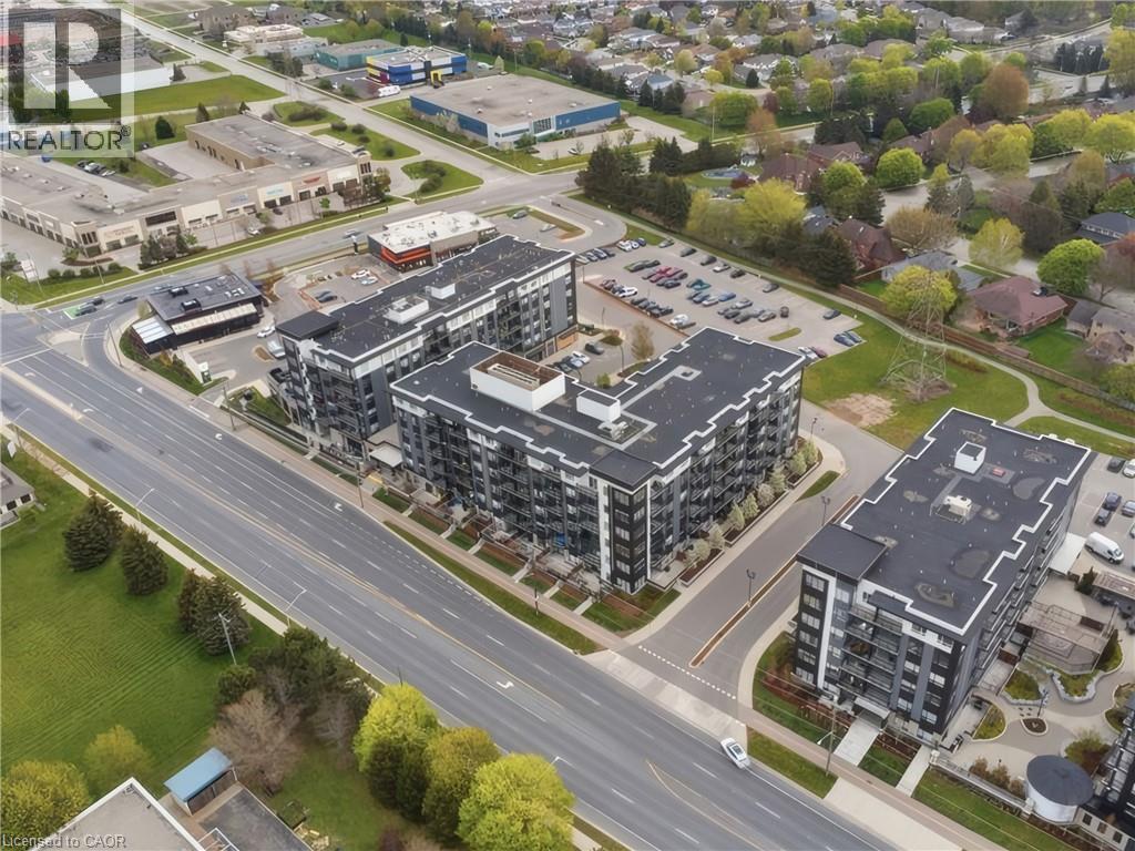 Modern multi-story buildings with dark facades and light trim - 251 Northfield Drive E Unit# 312, Waterloo, ON