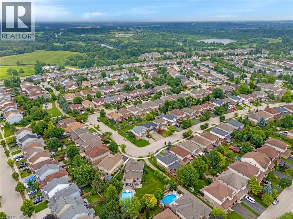 Residential neighborhood featuring numerous detached homes with varied rooflines and a mix of single-story and multi-story designs - 711 Angler Way, Waterloo, ON - Outdoor With View