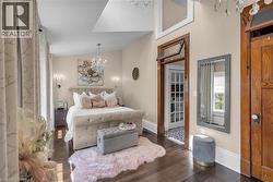 Light shines through the south-facing dormer into the primary bedroom. - 
