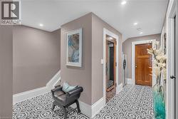 Entering the lower level, the same large windows make this feel like anything but a basement. - 