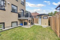 Backyard waiting for your lounge chairs and umbrella to enjoy summer. - 